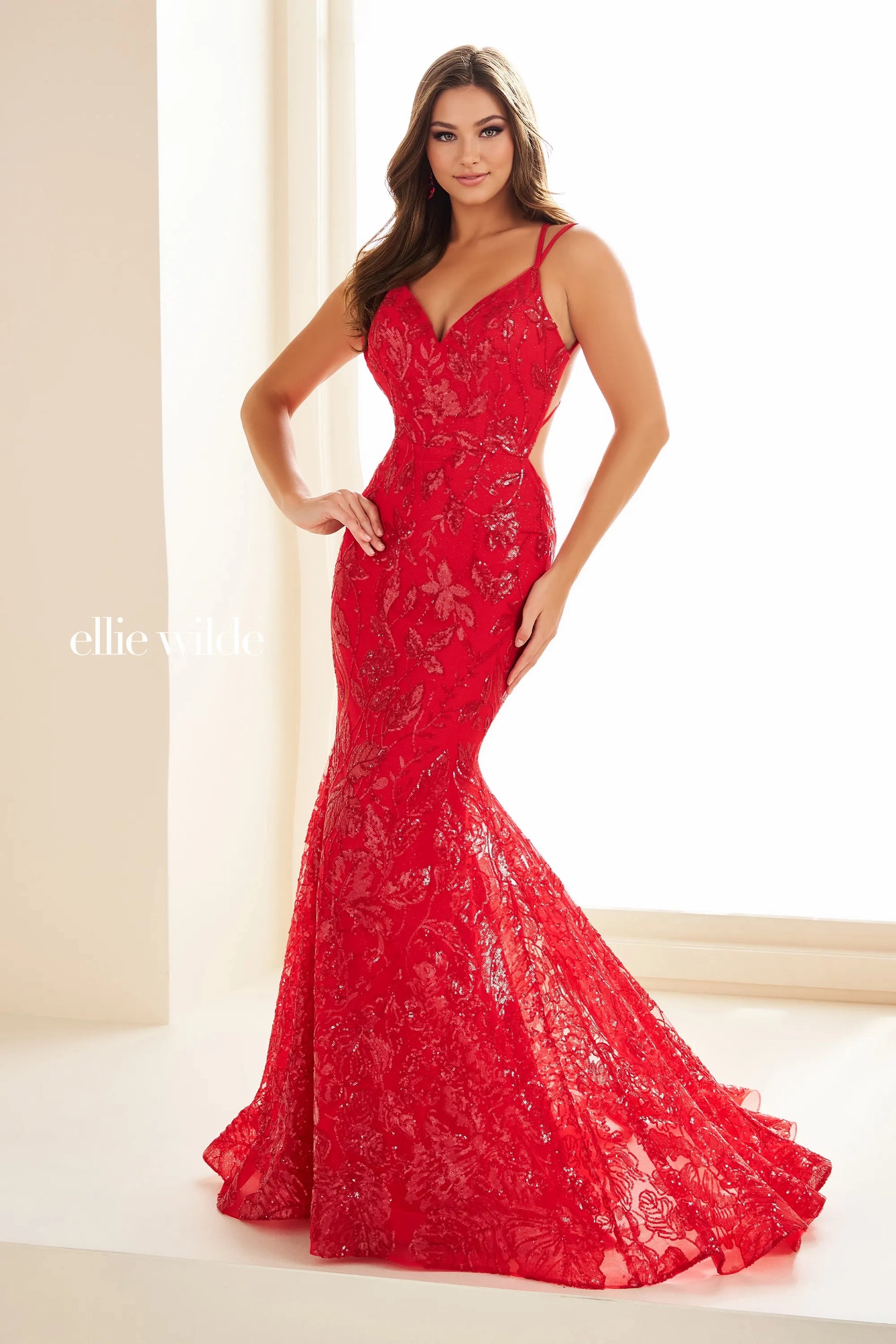 Expertly designed by Ellie Wilde EW36034 this long backless mermaid prom dress is a show-stopping piece. With its shimmering sequins and figure-flattering silhouette, this gown will make you feel like the belle of the ball. Perfect for pageants, prom, or any special occasion, this dress is sure to turn heads.