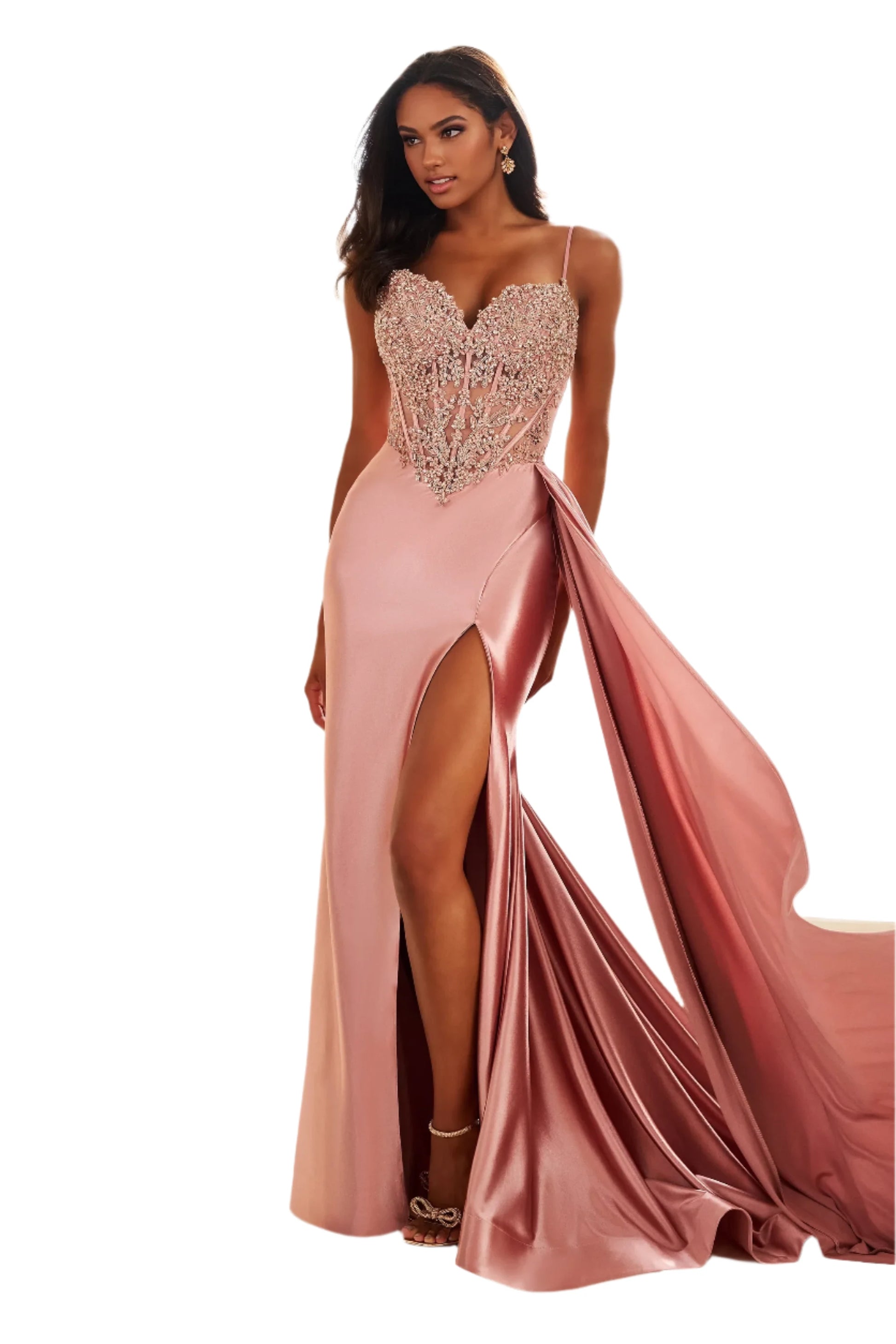 Expertly crafted with sheer lace and a corset bodice, the Ellie Wilde EW36064 prom dress exudes elegance and sophistication. The overskirt and slit add a touch of drama to this stunning formal evening gown. Channel your inner prom queen or pageant winner with this exquisite piece.