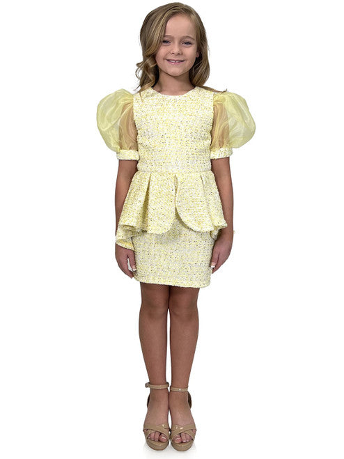 Marc Defang's 5141 short tweed dress offers a stylish and professional look for your daughter's special occasions. This formal dress features and eye-catching puff sleeves and a playful ruffle skirt, while the tweed fabric ensures durability. Perfect for a pageant or an interview, this dress is sure to make a memorable impression.  Sizes: 4-14  Colors: Lemon, Mint, Blush, Light Blue