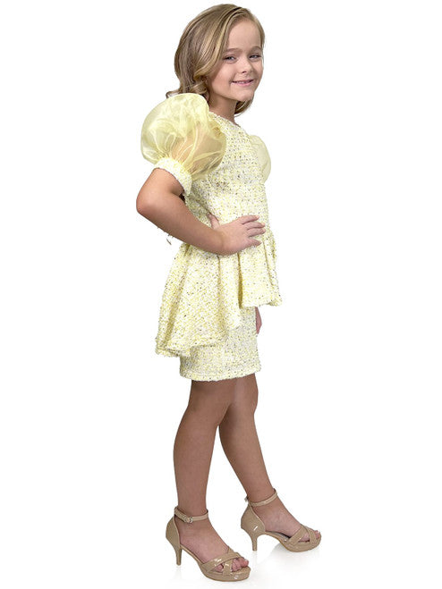 Marc Defang's 5141 short tweed dress offers a stylish and professional look for your daughter's special occasions. This formal dress features and eye-catching puff sleeves and a playful ruffle skirt, while the tweed fabric ensures durability. Perfect for a pageant or an interview, this dress is sure to make a memorable impression.  Sizes: 4-14  Colors: Lemon, Mint, Blush, Light Blue