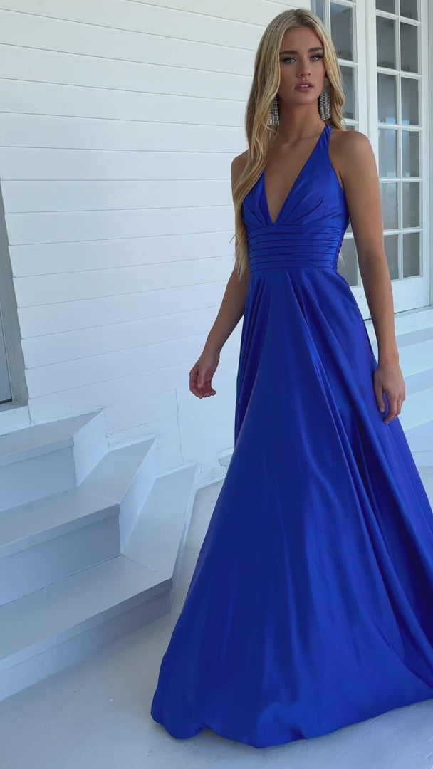 Stay elegant and sophisticated all night long with the Ava Presley 39562 Long Prom Dress. Featuring a flattering A-line silhouette, beautifully pleated bodice, and a stunning open back, this dress is perfect for any formal occasion or pageant event. Feel confident and glamorous in this timeless and stylish gown.