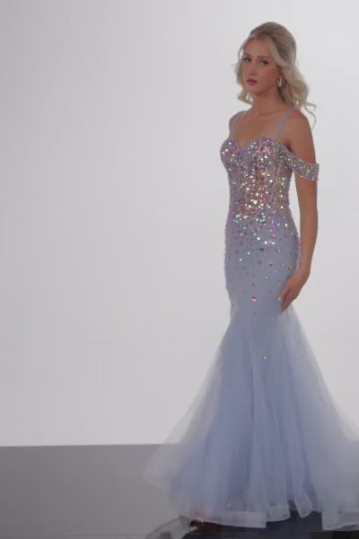 The Jovani 36730 is a striking formal gown designed to make a bold statement at your special event. It is crafted from tulle, which provides a soft and ethereal feel, draping beautifully to add an element of grace to your look. This dress is styled as a mermaid gown, known for its curve-enhancing silhouette that flares out dramatically at the bottom. One of its standout features is the horsehair trim, which adds structure to the mermaid skirt, allowing it to maintain its shape beautifully. 