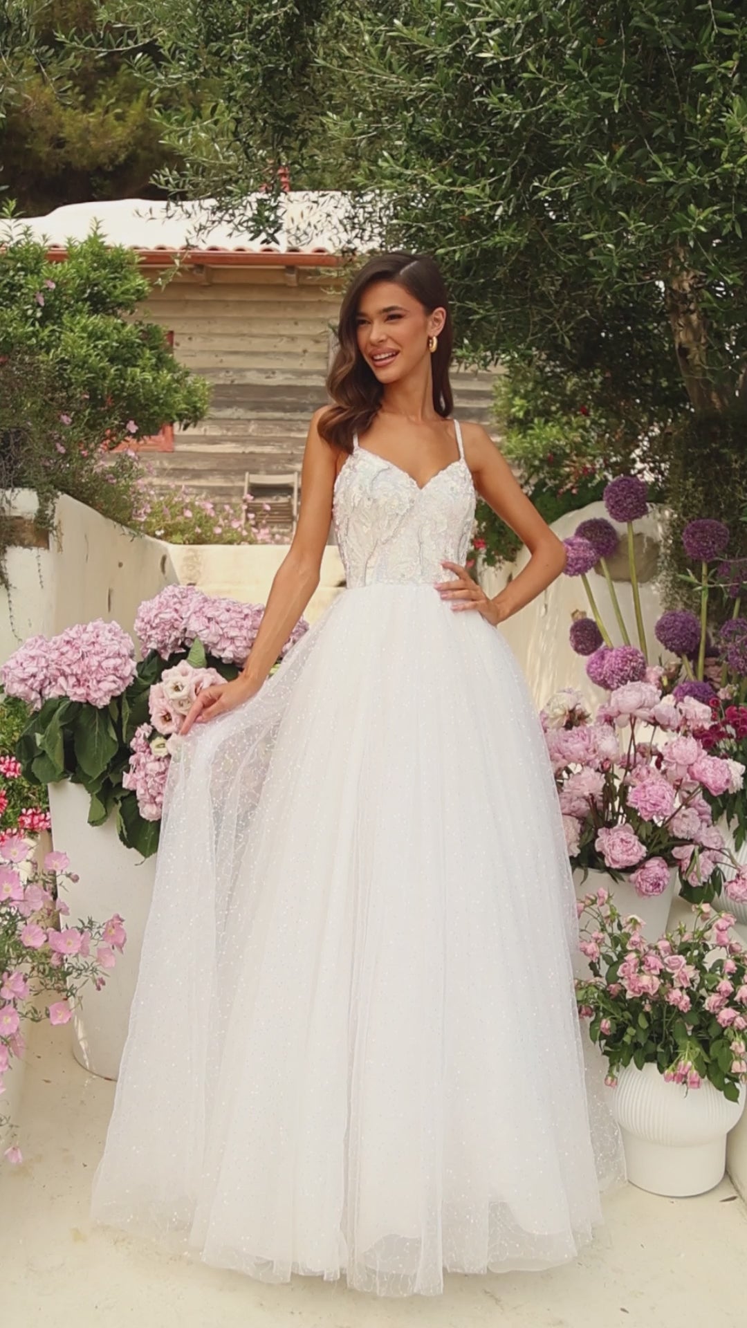 This Amarra 94020 spectacular tulle prom gown with a sweetheart neckline and beaded crystals will have you feeling like a princess for the night. Its color - white - is dazzling, and sparkles even more in the light of the beaded crystals that decorates the shimmering tulle skirt. Above the skirt, is the beautiful bodice designed delicately with sequins with sparse coloring of light blue, yellow and brown. 