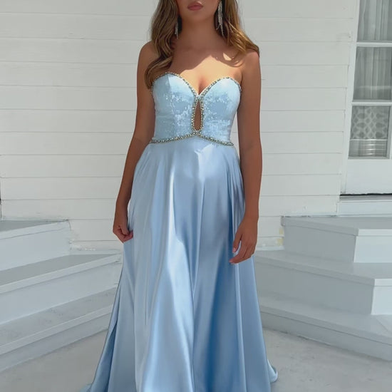 This Ava Presley 39236 long prom dress features a sweetheart neckline and intricate beaded detailing on luxurious satin for a sophisticated and elegant look. Perfect for formal events and pageants, this gown will make you feel like a true beauty queen.