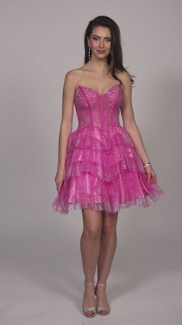 Get ready to sparkle in this Short Glitter Layer Sheer Corset Homecoming Dress by Dave &amp; Johnny. Designed with a flattering A Line cut, this cocktail gown is perfect for any special occasion. The glitter overlay adds a touch of glamour, while the sheer corset provides a sexy and unique detail. Channel your inner fashionista with this stunning dress.