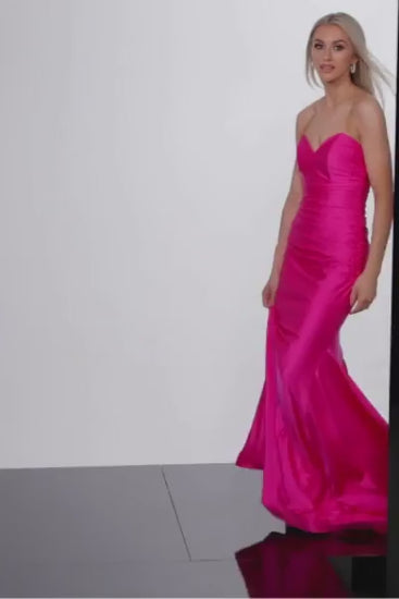 This stunning Jovani JVN37006 dress features a long ruched mermaid silhouette, perfect for any formal occasion. Made with high-quality jersey fabric, its strapless design exudes effortless elegance. Elevate your prom night or special event with this timeless and figure-flattering piece.  Sizes: 00-24  Colors: Black, Fuchsia