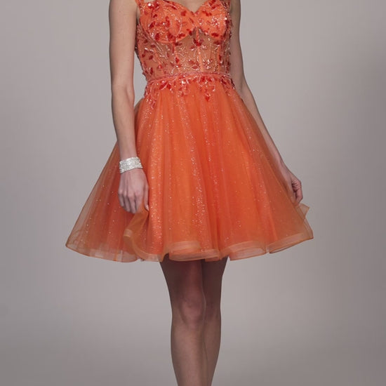 This Dave &amp; Johnny 12038 Beaded Shimmer Homecoming Dress is crafted with tulle in an elegant A-line silhouette and features off-the-shoulder detailing. The intricate beading adds a touch of shimmer, making it perfect for any special occasion. Expertly designed to flatter your figure, this dress is both stylish and comfortable.