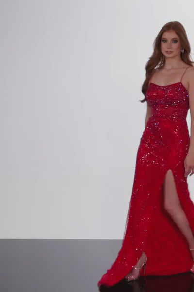 Jovani 26084 floor-length prom dress is a showstopper, designed to make a striking entrance at any formal event. Its form-fitting silhouette hugs your curves, creating an elegant and captivating look that is sure to turn heads. One of the standout features of this dress is the high slit, which adds a touch of drama and allure as you move gracefully. The dress is embellished with sparkling stones, creating a dazzling effect that catches the light and adds a glamorous touch to your overall appearance.