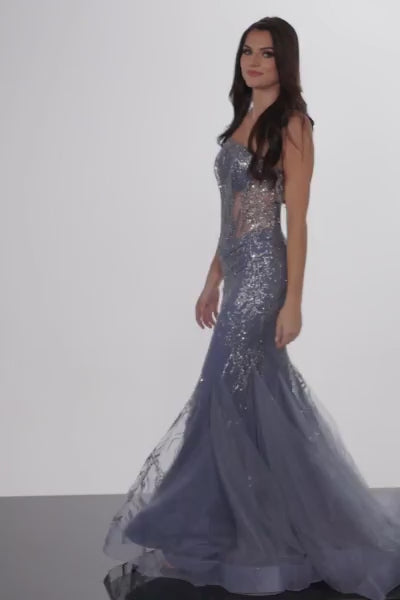 The Jovani 26112 is a glamorous prom dress from the formal collection, designed to make a stunning and unforgettable statement at your special event. Crafted from mesh, this dress is lightweight and breathable, providing a modern and luxurious appearance. It is adorned with glitter embellishments that add a touch of opulence and shimmer to your overall look.