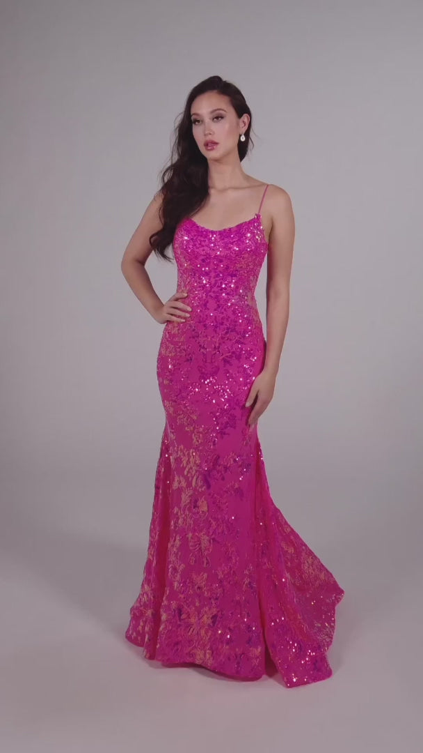 The Ellie Wilde EW35015 is a unique showstopper, featuring a fitted sequin stretch mesh fabric with a long length, scoop neckline, mermaid silhouette, sleeveless design, open back and natural waistline. Perfect for pageants, prom or any special occasion.  COLOR: MIDNIGHT, LIGHT BLUE, LILAC, HOT PINK SIZE: 00 - 16