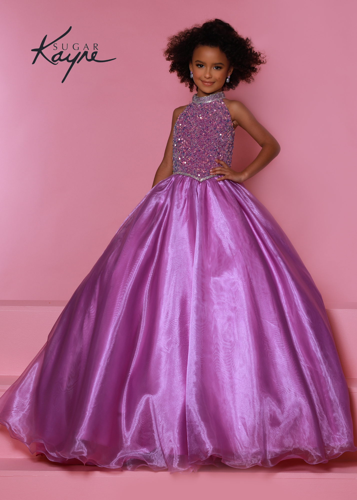 Sugar Kayne C302 sequin stretch velvet and organza ballgown features a stunning beaded halter with dropped waist and rhinestone trim and beaded strap back  Available Sizes: 2-16  Available colors: Aqua, Cotton candy, Orchid, Powder Blue