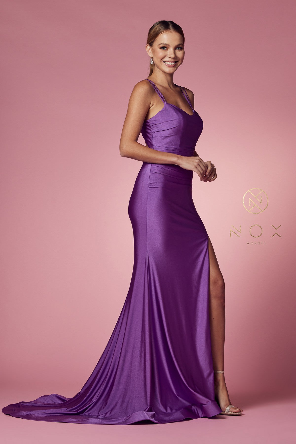 Nox Anabel T481 Long Fitted Jersey Prom Dress Backless Corset Slit Formal Gown Train Sleek and chic with a lightweight feel, this gorgeous scoop neck with spaghetti straps fitted gown by NOX ANNABEL is as cool as it is comfortable. Available Colors: Dusty Rose, Fuchsia, Lavender, Neon Orange, Black, Red, Sunflower, Iris