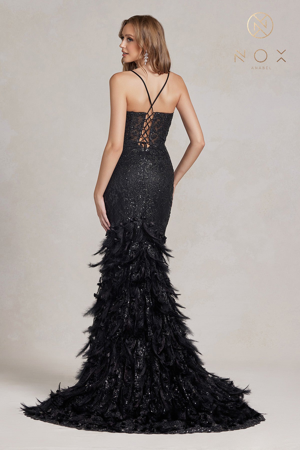 Nox Anabel C1111 Long Sheer Bodice with plunging neckline, Glitter 3D Lace embellished Feather Mermaid Skirt with train. Prom Dress Formal Evening Gown with corset back.  Sizes: 00-16  Colors: Black, Mauve, Light Blue