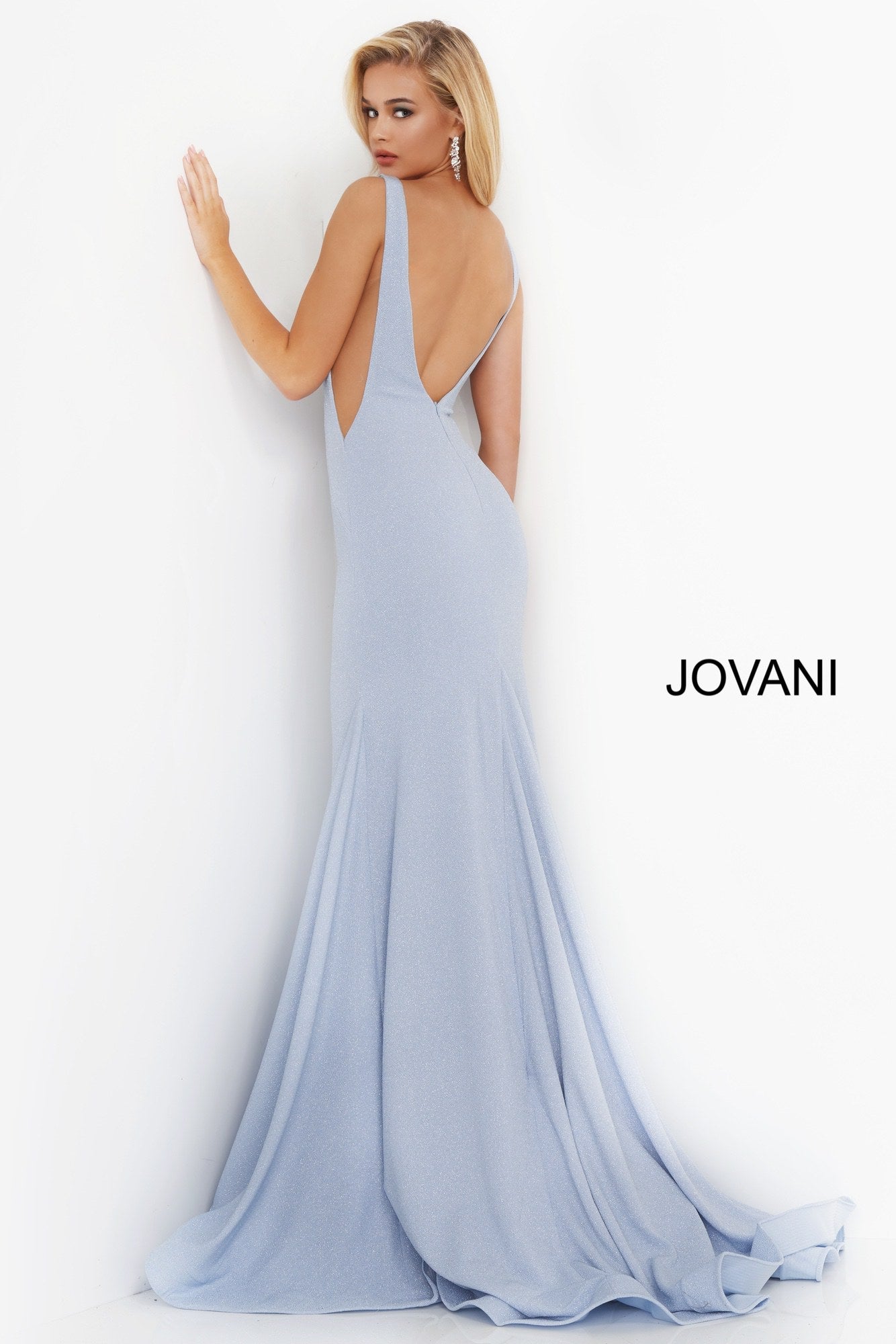 Jovani 02132 Blue V Neck Jovani Prom Dress 02132 Long Sexy Fitted Mermaid Prom Dress, Deep V Plunging Neckline with a Fit & Flare Shape Leading to a lush trumpet skirt with horse hair trim. Stretch Glitter fabric adds a touch of glam and a comfortable wear all night long!  Available Sizes: 00-24  Available Colors: blue, champagne, orange, pink