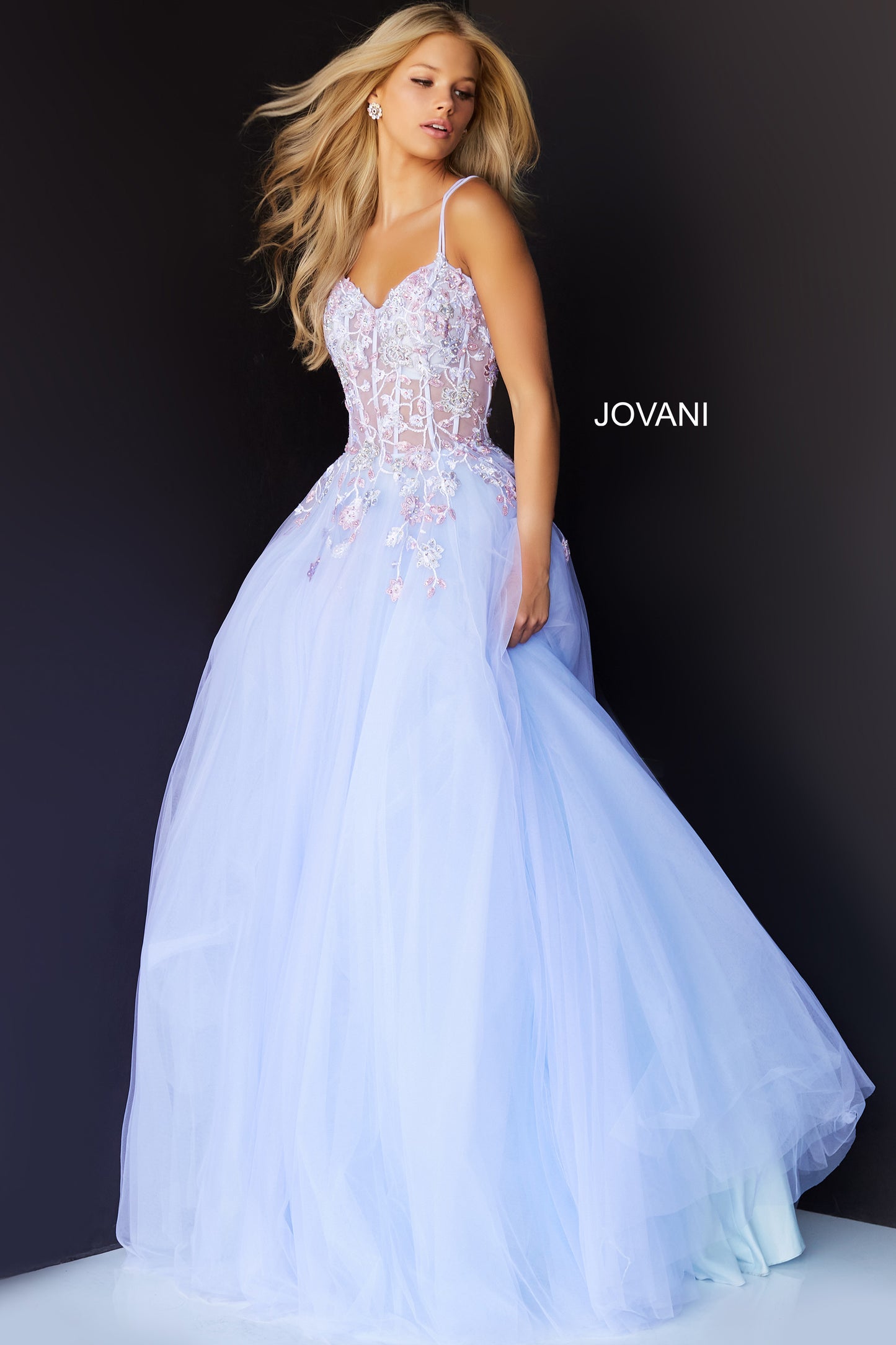 Jovani 06207 Lilac Prom Dress by Jovani.  V neckline sheer floral embellished corset bodice with a v neckline and crisscross tie open low back.  Tulle skirt. 