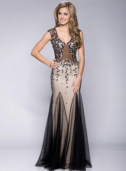 Envious Couture 15131 in Black/Nude. This gown features an illusion bodice that has cap sleeves and a scoop neckline for a lavish and enticing style. Sheer details and glittering crystals sparkle and shine creating a captivating ensemble that flutters to the full-length hemline, finished in a fancy fishtail silhouette.