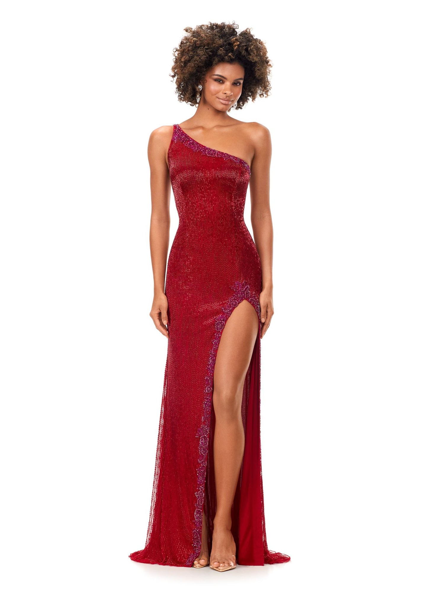 Ashley Lauren 11352 This liquid beaded gown features a one shoulder neckline with crystal trim and a left leg slit. The look is complete with a sweep train. One Shoulder Crystal Details Sweep Train Liquid Beaded COLORS: Periwinkle, Ivory, Black, Red