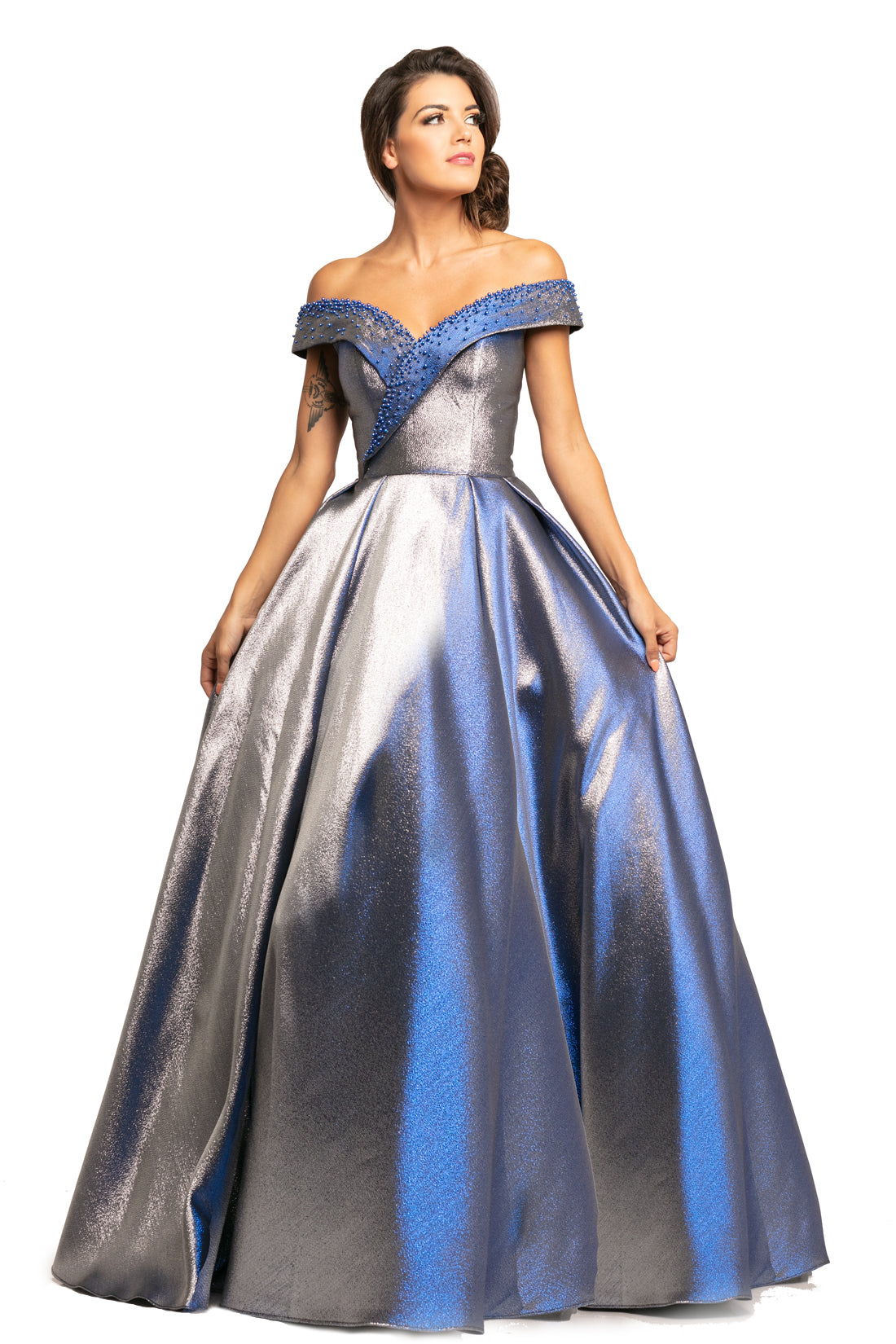 Johnathan Kayne 2072 is an off the shoulder Prom Dress, Pageant Gown & Formal Evening Wear. Featuring a Metallic Shimmer Brocade Material. This Ballgown has a full Pleated skirt, Fitted Off the Shoulder Bodice with pearl embellishments. 