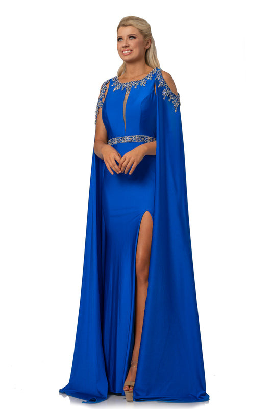 Johnathan Kayne 2075 is a Cape Prom Dress, Pageant Gown & Formal Evening Wear. This 4 way stretch Lycra gown features an Embellished illusion plunging high neckline. Embellished Over Cape Features Shoulder cutouts with a keyhole cutout in the back. skirt features a slit.