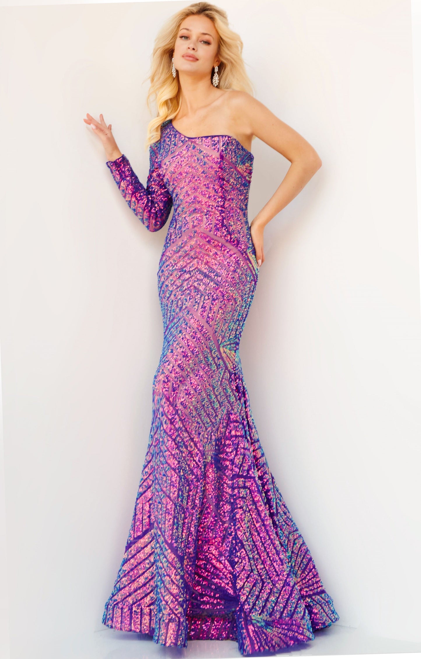 Jovani 24098 One Shoulder Long Sleeve Fitted Sequin Mermaid Prom Dress Pageant Gown Jovani 24098 is the perfect choice for a special occasion. It features a one-shoulder neckline, long sleeves, and a mermaid silhouette adorned with fantasy sequins. This fitted gown is designed to flatter, making you look and feel amazing.  Sizes: 00-24  Colors: EMERALD, IREDENSCNT BLUE, IRIDESCENT VIOLET, NEON HOTPINK, PEACOCK