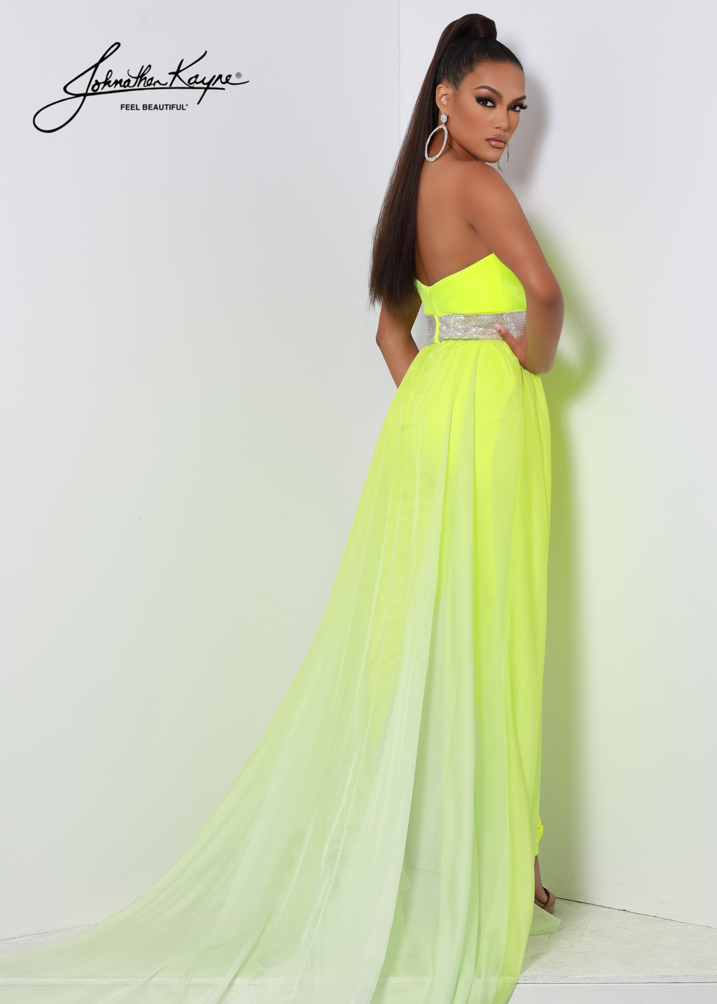 Johnathan Kayne 2609 Long Velvet Jumpsuit Chiffon Overskirt Crystal Waist Pageant Fun Fashion Rock out your next fun fashion event in this dazzling stretch velvet fitted jumpsuit with detachable ombre chiffon overskirt. The rhinestone waist band will be sure to highlight your waist!  Sizes: 10  Colors: Neon Yellow