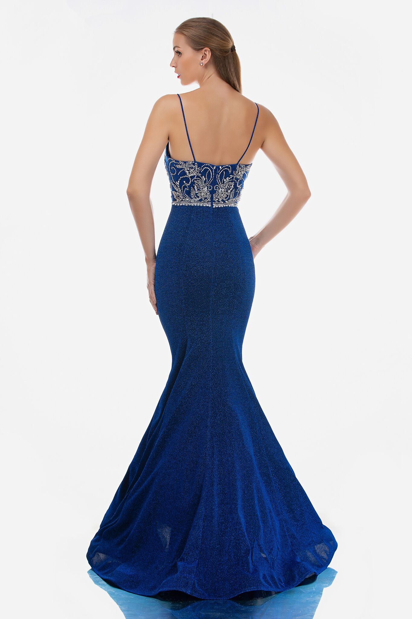 Nina Canacci 3160 is a long Glitter Knit Long Fitted Mermaid Fit & Flare Silhouette Prom Dress with a lush trumpet skirt and sweeping train. Embellished Crystal Rhinestone bodice with a deep V plunging neckline and spaghetti straps. Great Pageant Dress  Available Sizes: 0-16  Available Colors: Royal