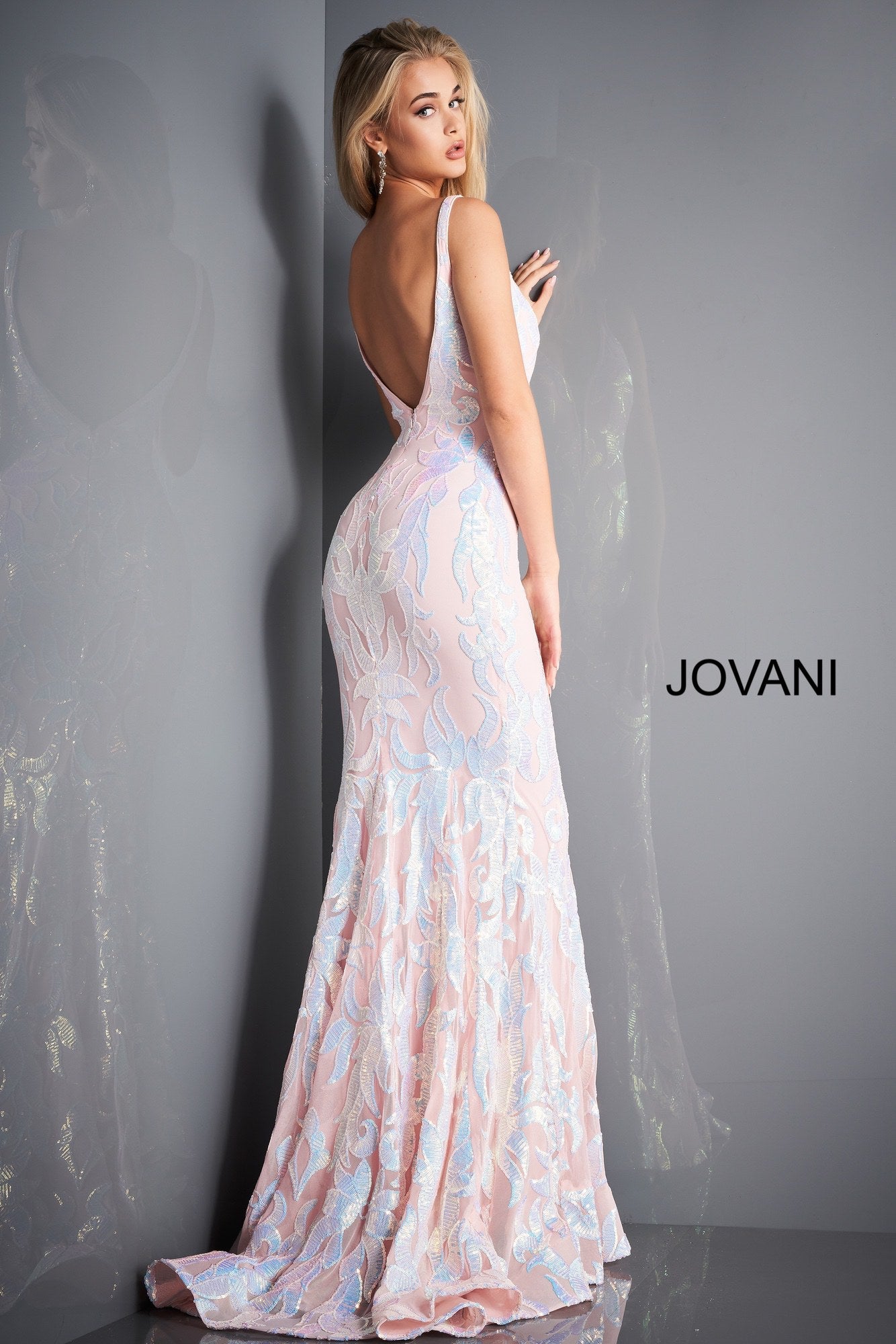 Jovani 3263 is a long Fitted Mermaid Prom Dress with a damask print sequin embellished pattern. Plunging V Neckline and open V Back. Lush Trumpet Skirt is great for the stage in this formal evening gown & Pageant Dress. Glass Slipper Formals