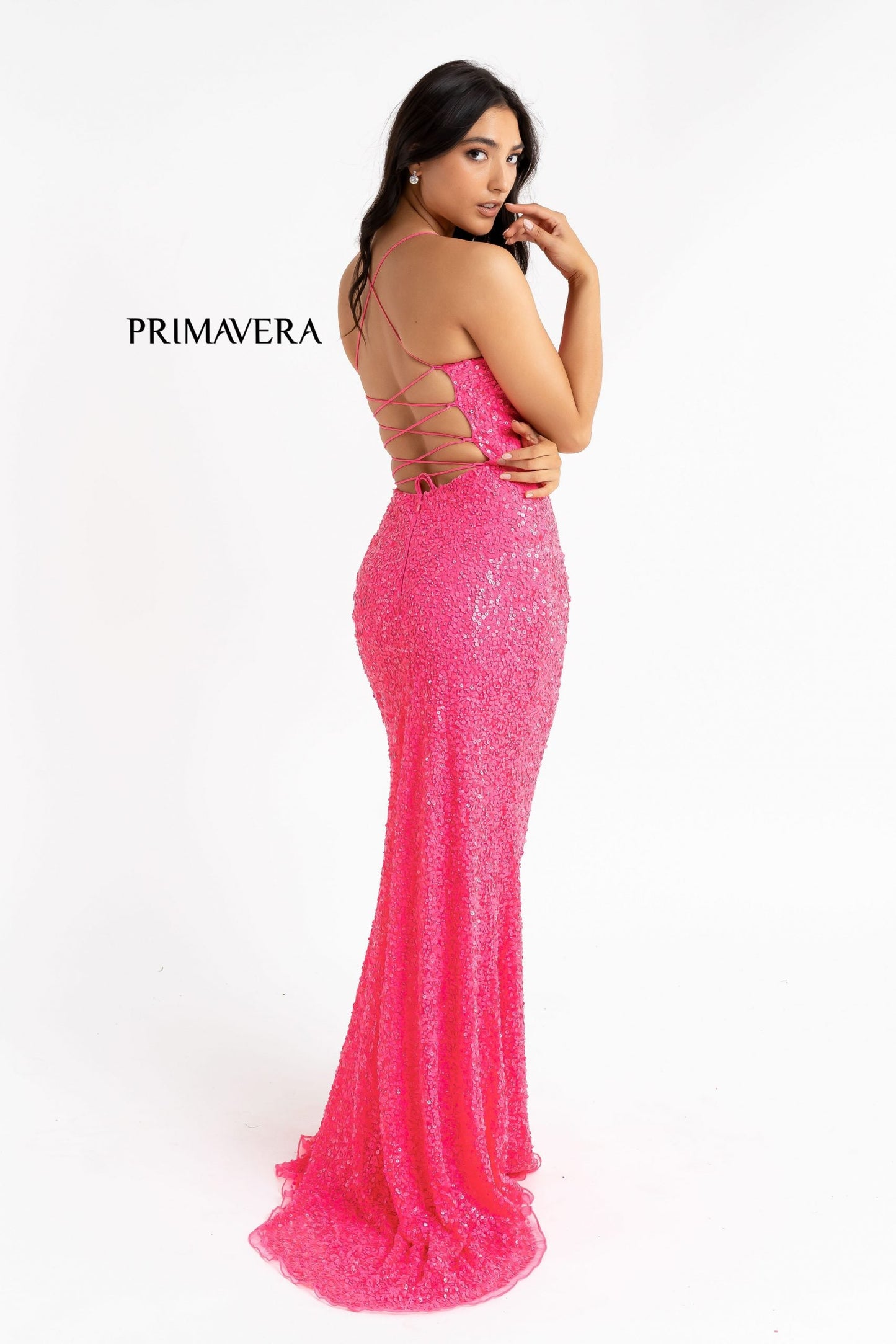 Primavera Couture 3290 This prom dress adds a pop to the multi sequins dress.  With a scoop neckline and spaghetti straps that cross and tie in the back.  This long evening dress has a side slit. 