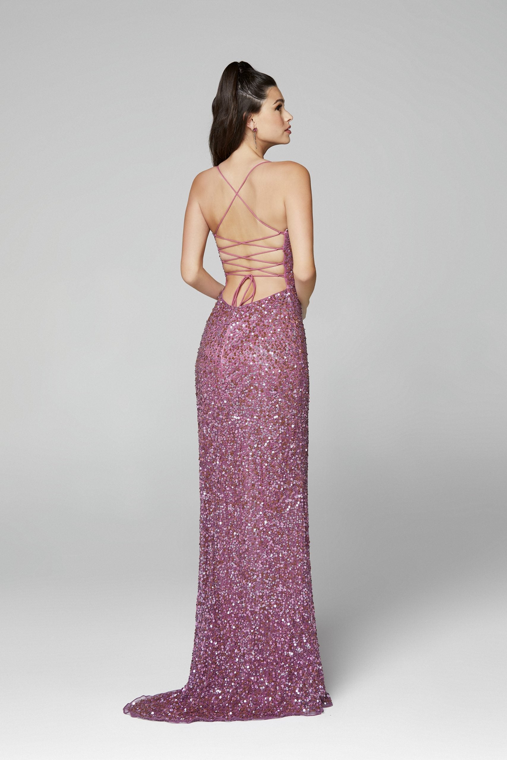 Primavera Couture 3290 This prom dress adds a pop to the multi sequins dress.  With a scoop neckline and spaghetti straps that cross and tie in the back.  This long evening dress has a side slit.  Available sizes:  000, 00, 0, 2, 4, 6, 8, 10, 12, 14, 16