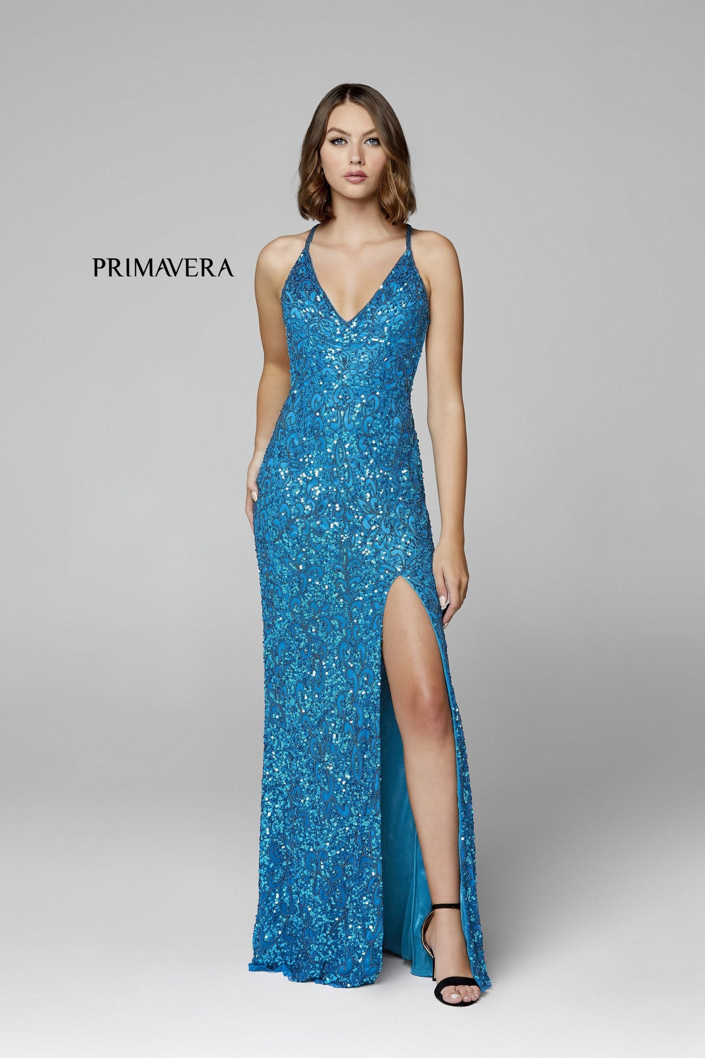 Primavera Couture 3295 Exclusive  Prom Dress, Formal Evening Gown.  This exclusive prom dress is designed with sequins throughout.  I has a V neckline with beaded spaghetti straps that crisscross in the open back.  It is long with a left side slit.  Available Colors:  FUSHIA,CREAM,EMERALD,IVORY,PEACOCK,BLACK,MIDNIGHT,NEON LILAC,NEON PINK,FORREST GREEN,PURPLE,TURQUOISE,CORAL,BLUE,RED,LIGHT BLUE,NEON SAGE