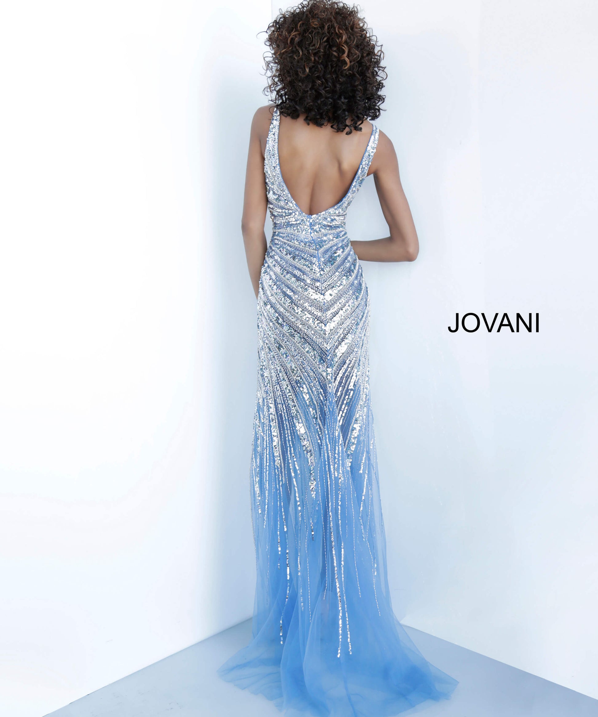 Jovani 3686 is a 2020 Prom Dress, Evening Gown, Pageant Dress & Formal Wear Attire. Featuring a Fully Crystal Embellished asymmetrical Bodice with detailed beading. Plunging V Neckline with high slit sheath silhouette with sheer mesh skirt.   Available Sizes: 00, 0, 2, 4, 6, 8, 10, 12, 14, 16, 18, 20, 22, 24  Available Colors: gold/silver, perriwinkle, platinum