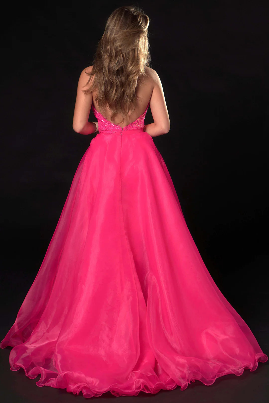 Ava Presley 37381 is crafted with a long, sheer sequin halter jumpsuit, detachable overskirt, V-neck backless design, and a hint of fun fashion. The result is a luxurious, glamorous look perfect for pageants.  Sizes: 0-16  Colors: Royal, Fuchsia, Iridescent Orange