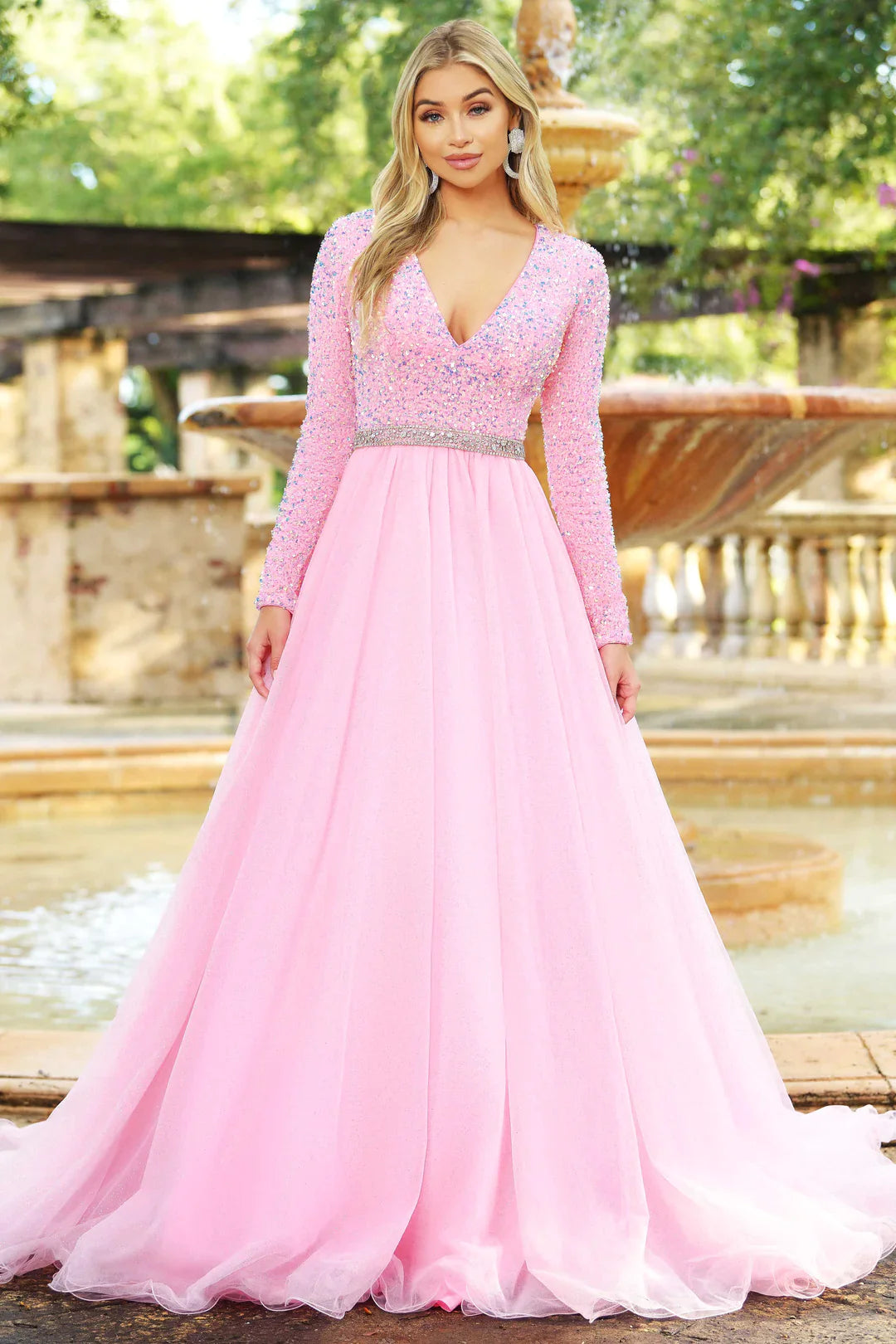 Ava Presley 38332 Long Sleeve Velvet Sequin Bodice with a V Neckline. Glitter Shimmer A Line Ballgown skirt with a crystal rhinestone waistband. full modest back coverage. Prom Dress Pageant Gown.  Sizes: 00-24  Colors: Royal, Red, Iridescent White, Iridescent Pink, Iridescent Light Blue