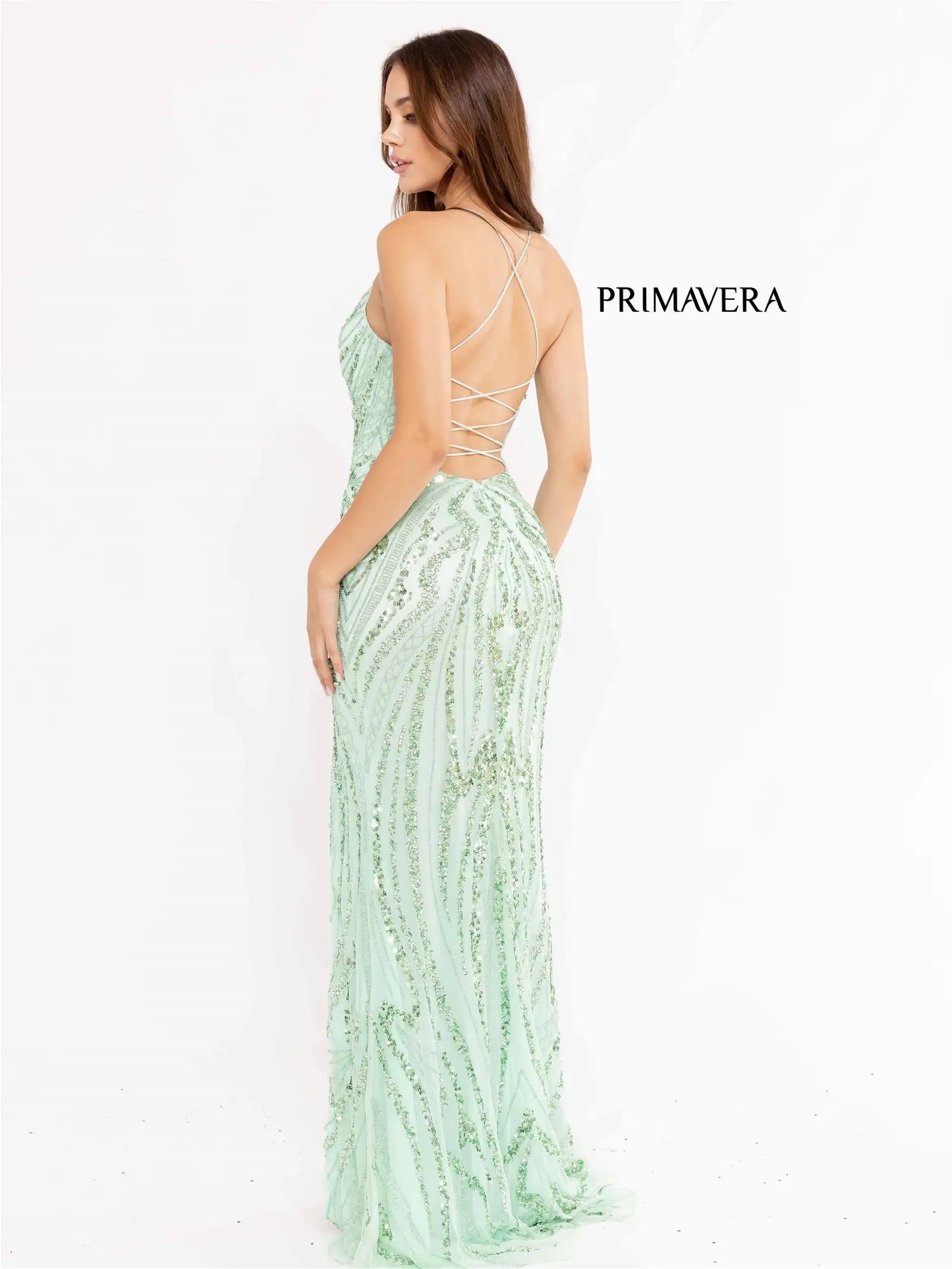 Primavera Couture 3958 Prom Dress Long beaded Gown. Its has a slit and a beautiful design on the gown.