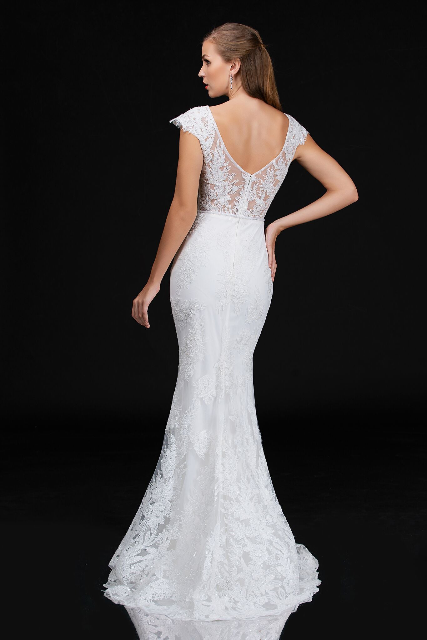 Nina Canacci 4203 is a long fitted embellished lace mermaid wedding dress. featuring a sweetheart neckline with cap sleeves with eyelash lace and a sheer lace back. Great destination bridal gown. Great for Plus Size. Mermaid fit & Flare Silhouette with a trumpet skirt  Available Sizes: 18  Available Colors: Ivory