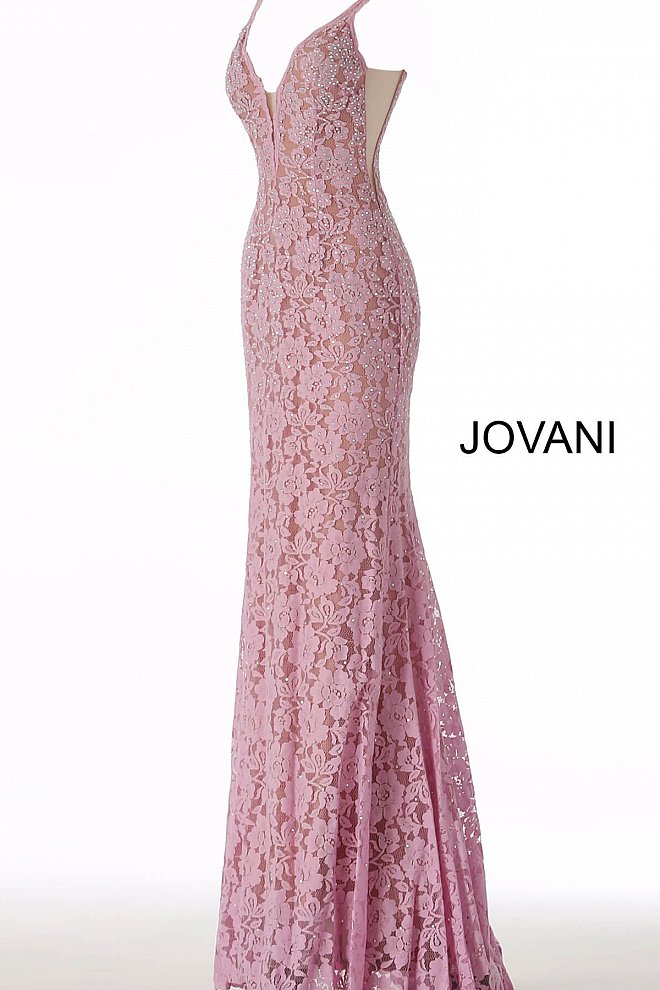 Jovani 48994 Stretch lace prom dress embellished with heat set stones, nude underlay, fitted silhouette, straps over shoulders, plunging v neckline with sheer mesh, sheer mesh inserts along the sides, sweeping train, low v back. Makes an excellent pageant gown or evening gown. 