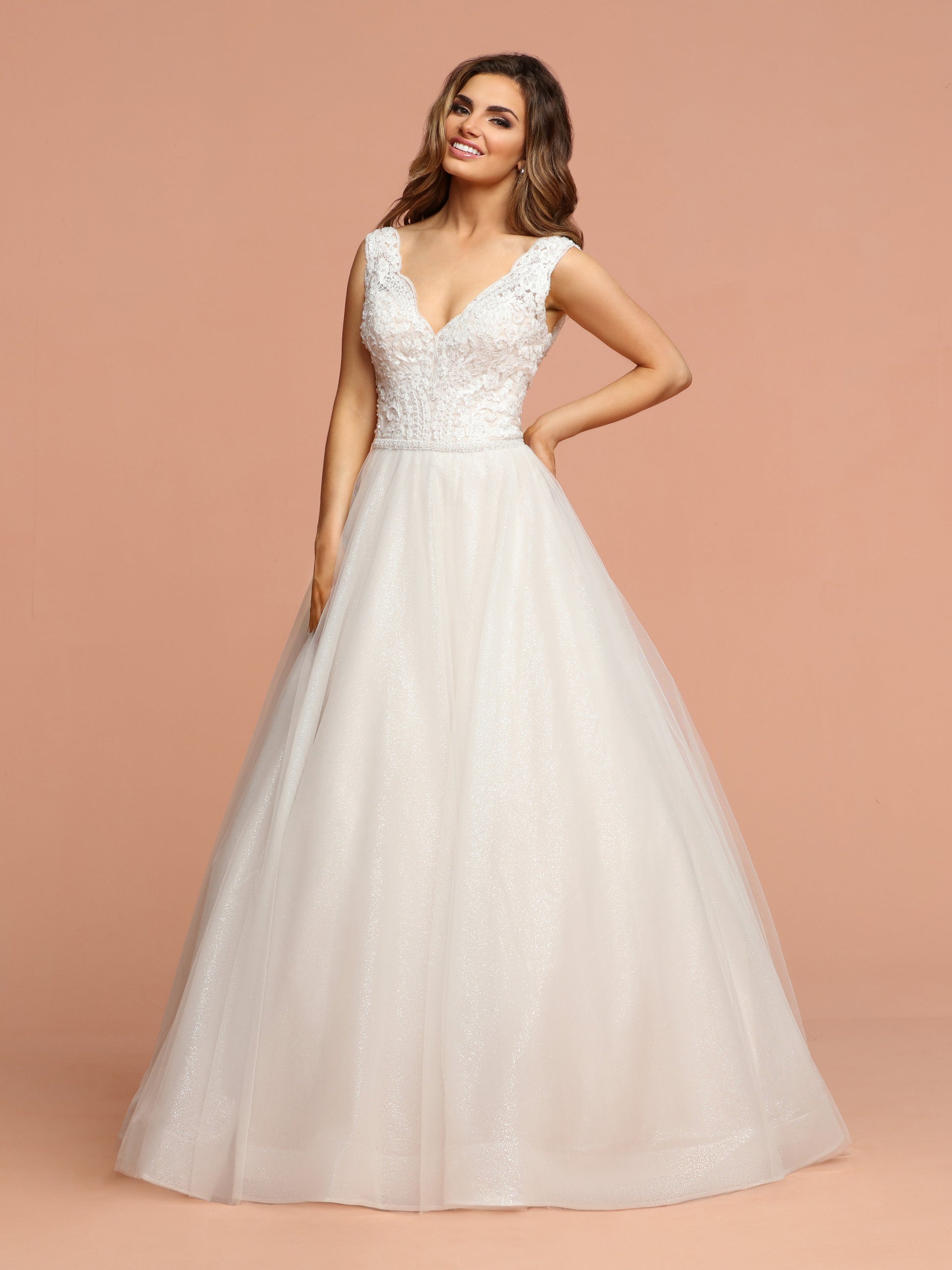 Davinci Bridal 50589 is a Gorgeous Glitter Shimmer Tulle Ballgown Wedding Dress. Featuring a beautiful eyelash lace embellished bodice with a V neckline and open V back. The full tulle skirt shimmers with a full train.  Available for 1-2 Week Delivery!!!  Available Sizes: 2,4,6,8,10,12,14,16,18,20  Available Colors: Ivory/Blush, Ivory/Ivory