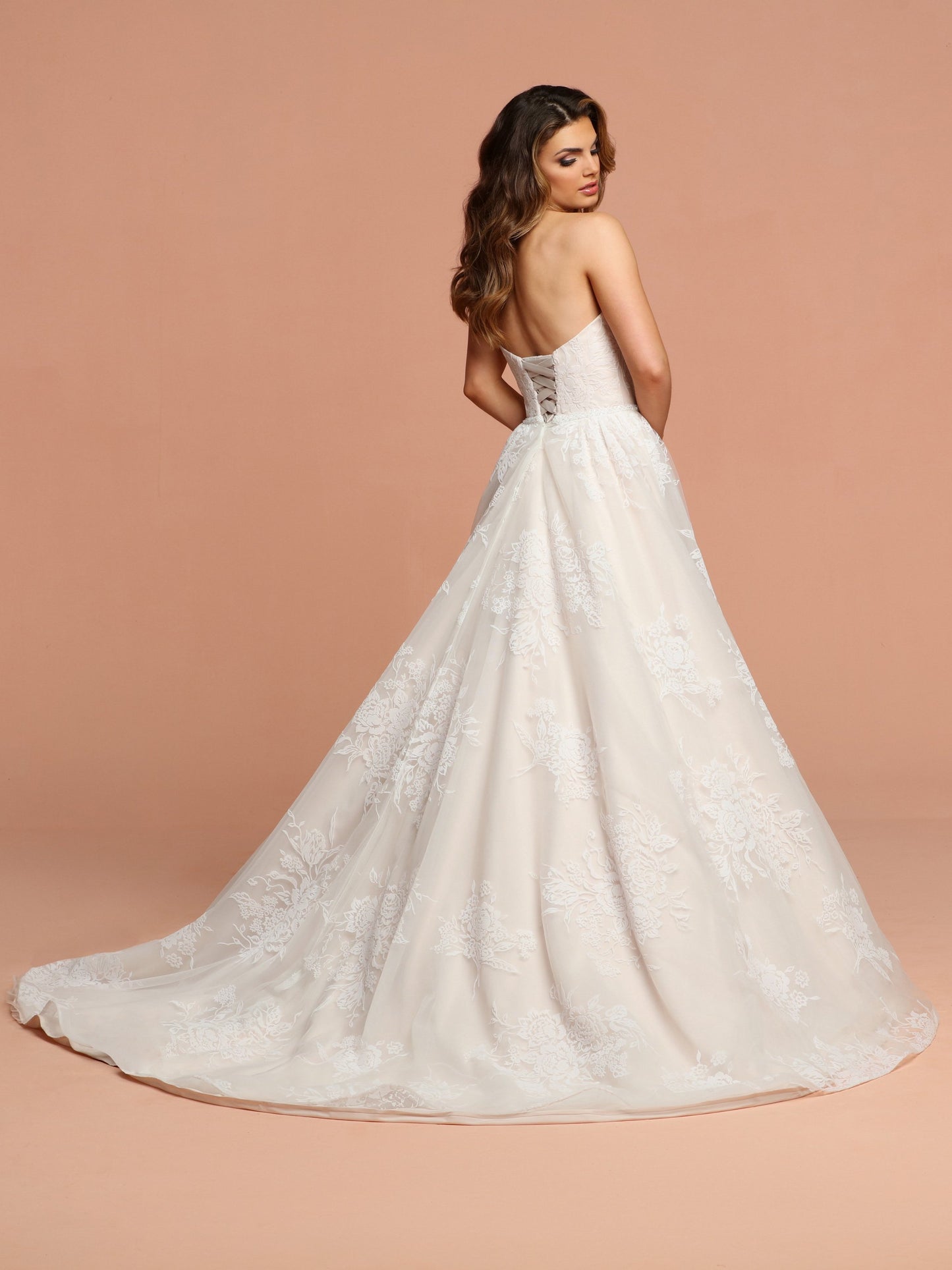 Davinci Bridal 50599 This flowing tulle gown has soft velvet like flowers throughout.  The sweetheart strapless bodice has a beaded belt at the waist extending into a lace up back. Available for 1-2 Week Delivery!!!  Available Sizes: 2,4,6,8,10,12,14,16,18,20  Available Colors: Ivory/Blush, Ivory/Ivory