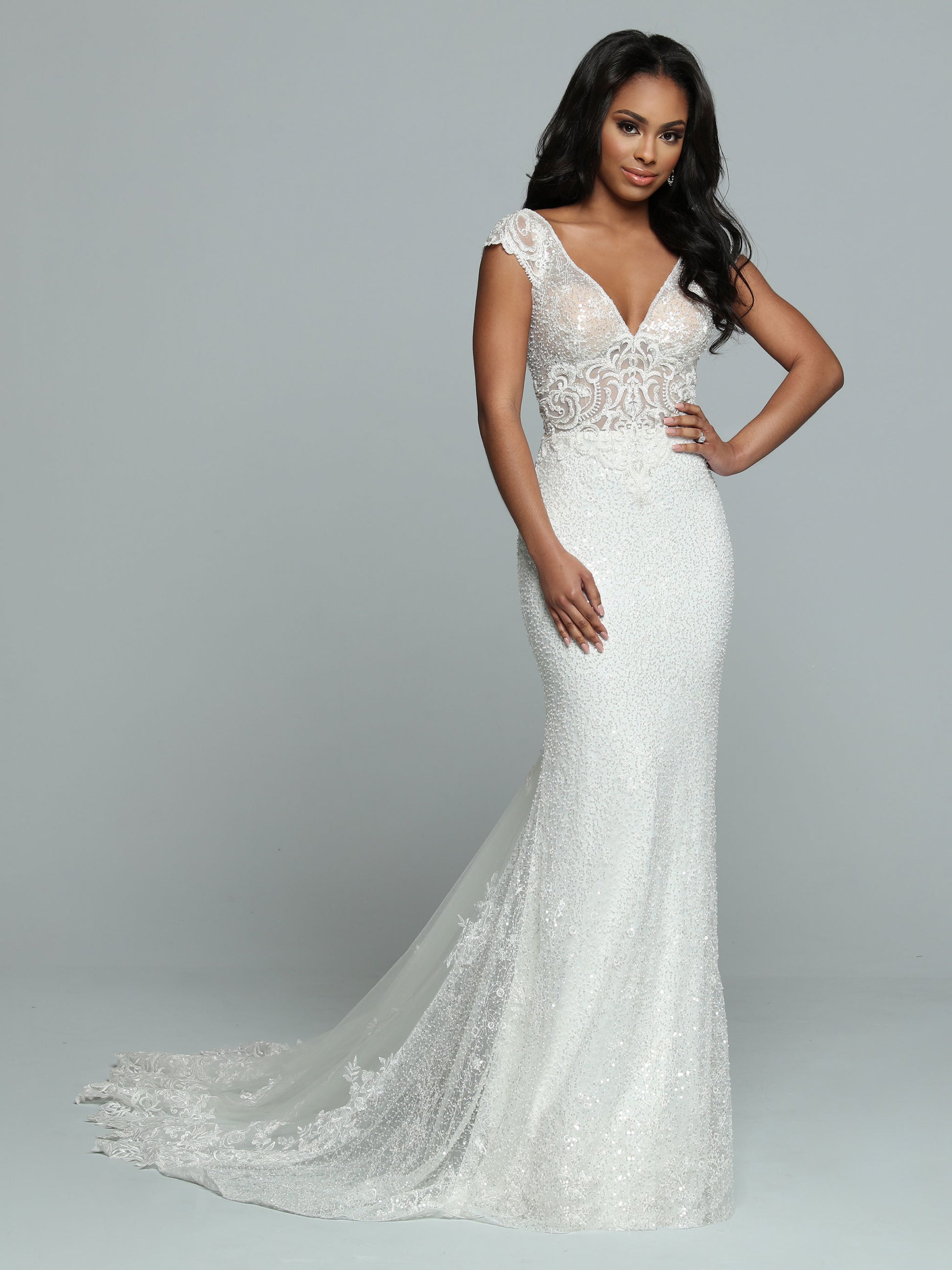 Davinci Bridal 50666 Long Sheer Sequin Mermaid Wedding Dress Lace Train Gown Sparkling Sequin Fit & Flare Sheath Wedding Dress features a Sheer Bodice with V-Neckline & Deep V-Back. Beaded Lace Applique covers the Bodice & Wide Off the Shoulder Straps. The Skirt has a Sheer Back Panel that ass Fullness to the Lace Edged Sheer Chapel Train.