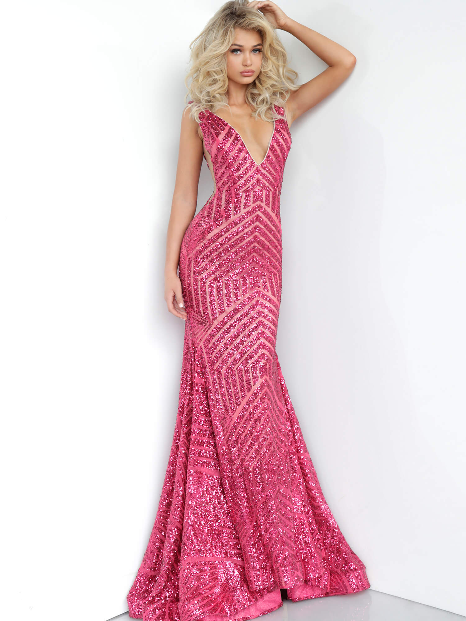 Long Jovani 59762 Prom Dress, Featuring a plunging neckline & A Fully sequined Fitted Mermaid Bodice. This Open V Back Pageant Gown & prom dress is perfect for the stage is has a lush trumpet sequin embellished skirt and sweeping train. 