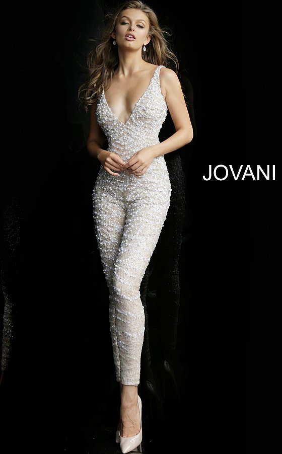 Jovani 60010 embellished v neckline jumpsuit with removable tulle overskirt  Available colors:  Nude/White, Nude/Black  Available sizes:  00-24   Details: Nude and white beaded prom jumpsuit with low v-neckline, sleeveless fitted bodice and low v-back, full length slim leg pants and detachable sheer tulle full length over-skirt.  