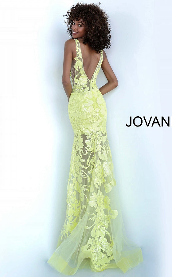 Jovani 60283 Available Colors: black, forest, fuchsia, light-blue, red, rose/gold, royal, tangerine, white, yellow Available Sizes: 00 - 24 Closure: Invisible Back Zipper with Hook and Eye Closure.   Details: Sheer mesh, sequin flower appliques, form fitting silhouette, floor length, sleeveless bodice, plunging V neck, V back, sheer mesh inserts on the sides. Long sheer embroidered and sequined deep v neck sleeveless formal gown with an open v-back by Jovani.