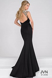 JVN47786 This is a black stretch jersey mermaid evening gown that features a scalloped jeweled sheer neckline and open back. Prom Dress 