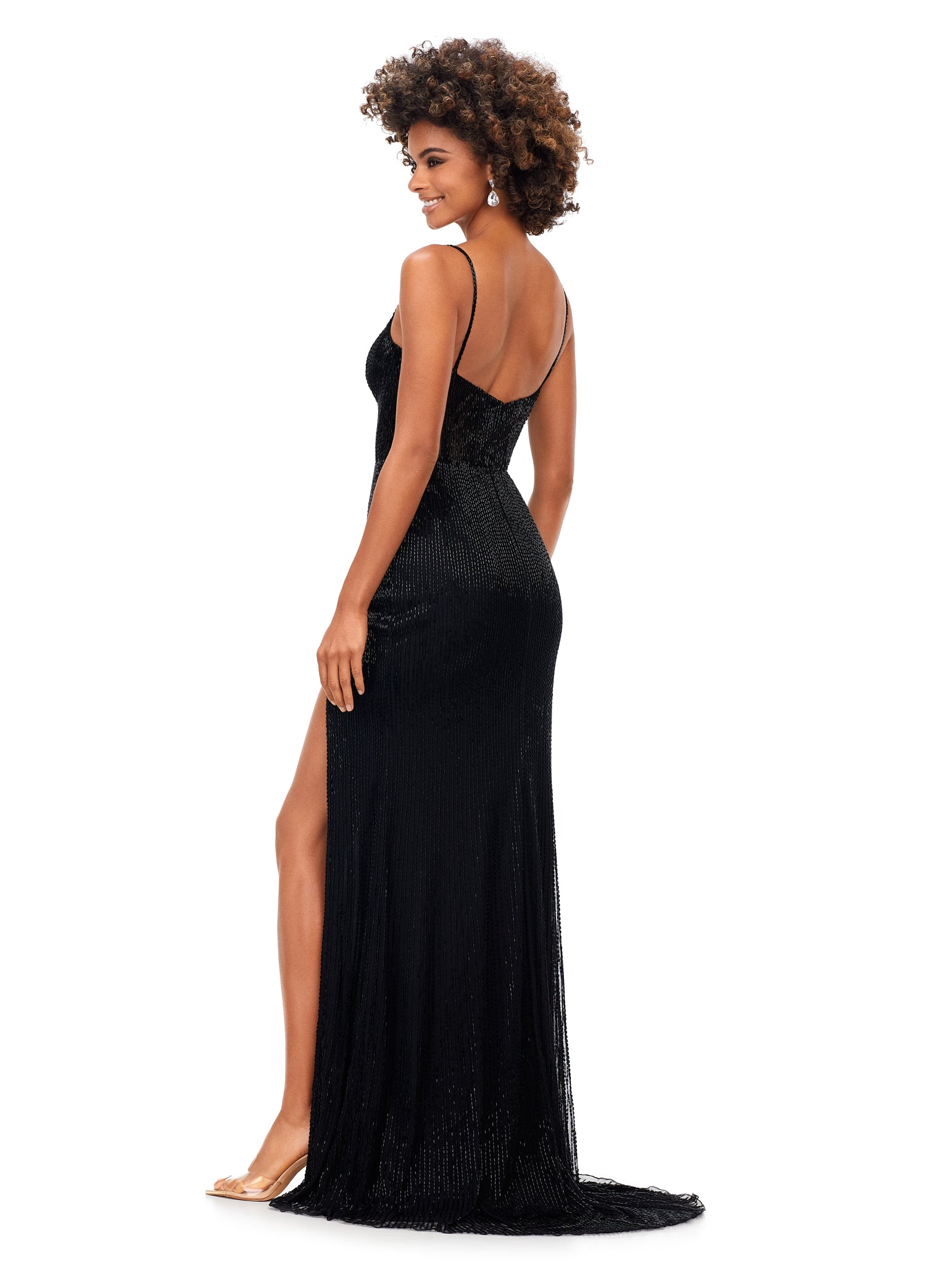 Ashley Lauren 11369 This Black liquid beaded style features an exposed bustier that is sure to accentuate your curves. The look is complete with sweep train and left leg slit.