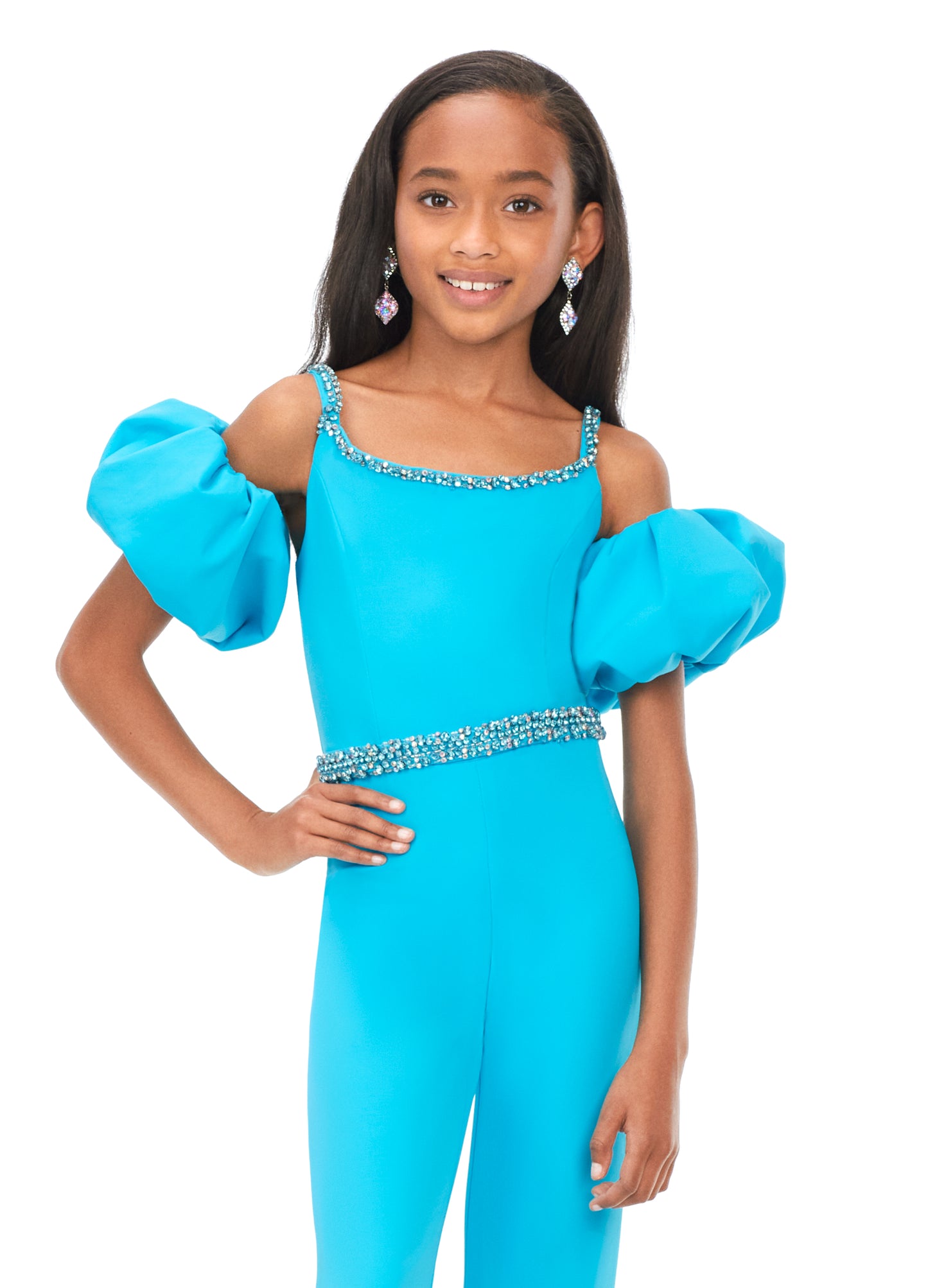 Ashley Lauren Kids 8164 Girls Off Shoulder Scuba Jumpsuit with Puff Sleeves  A scuba jumpsuit with off shoulder puff sleeves? We're obsessed! This jumpsuit has a beaded neckline and waist band to offer the right mix of classy and fabulous.