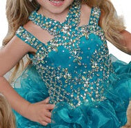 Ritzee Girls B279 is a short Layered ruffle cupcake Pageant Dress. Featuring a multi strap high neckline with AB Crystal Rhinestone Embellishments along the Top & Bodice. Open Cutout embellished back. Stunning stage gown!  Available Sizes:  2  Available Colors: Jade