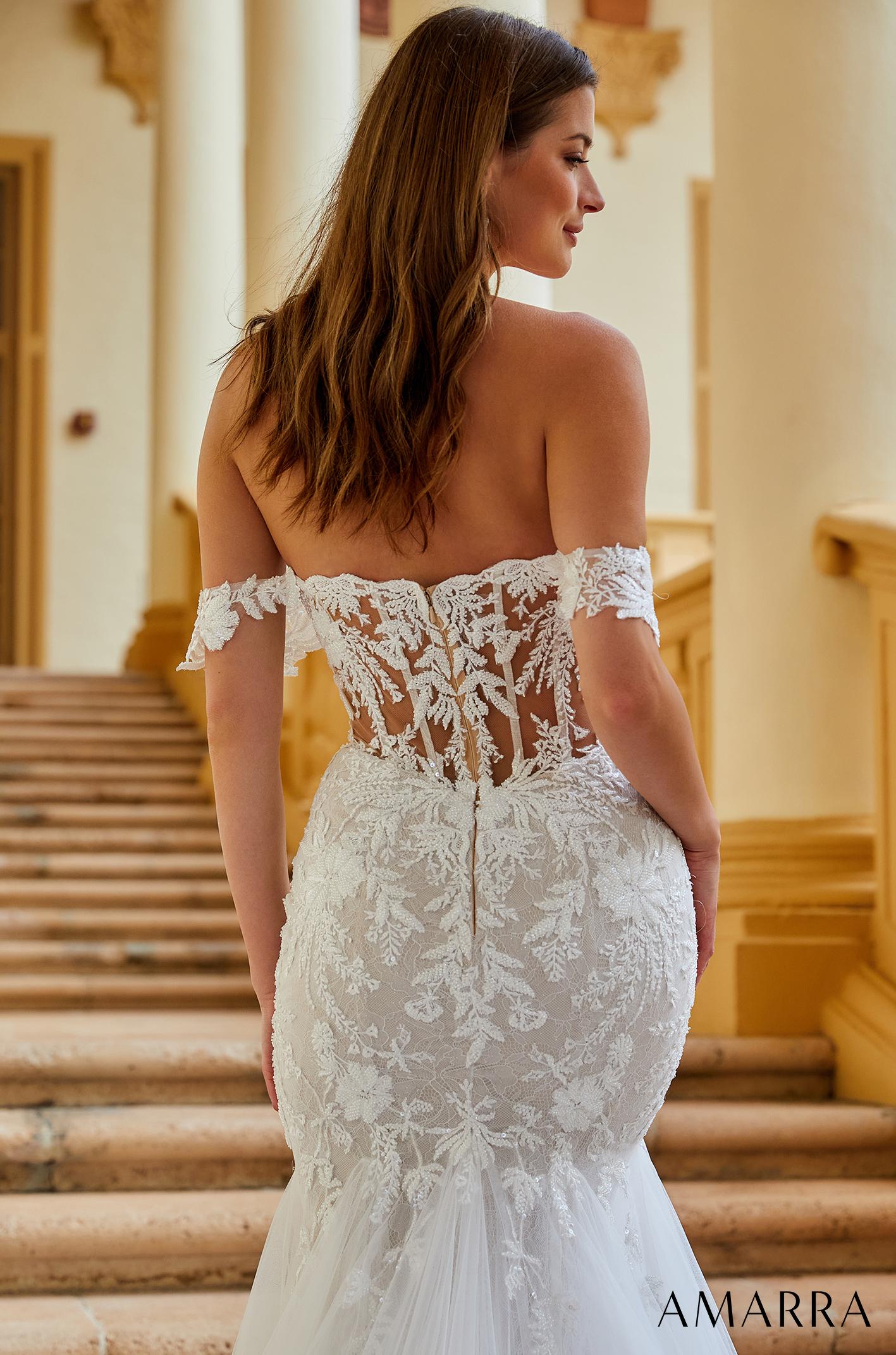 Amarra BELLA 84375 Sheer Beaded Mermaid Wedding Dress Off the shoulder Bridal Gown Featuring detachable shoulder straps that gracefully hang off the shoulders and beautiful lace embroidery throughout the bodice, Bella is sure to have you looking and feeling like a majestic beauty. The fitted waist hugs and highlights your curves, creating a beautiful hourglass silhouette.