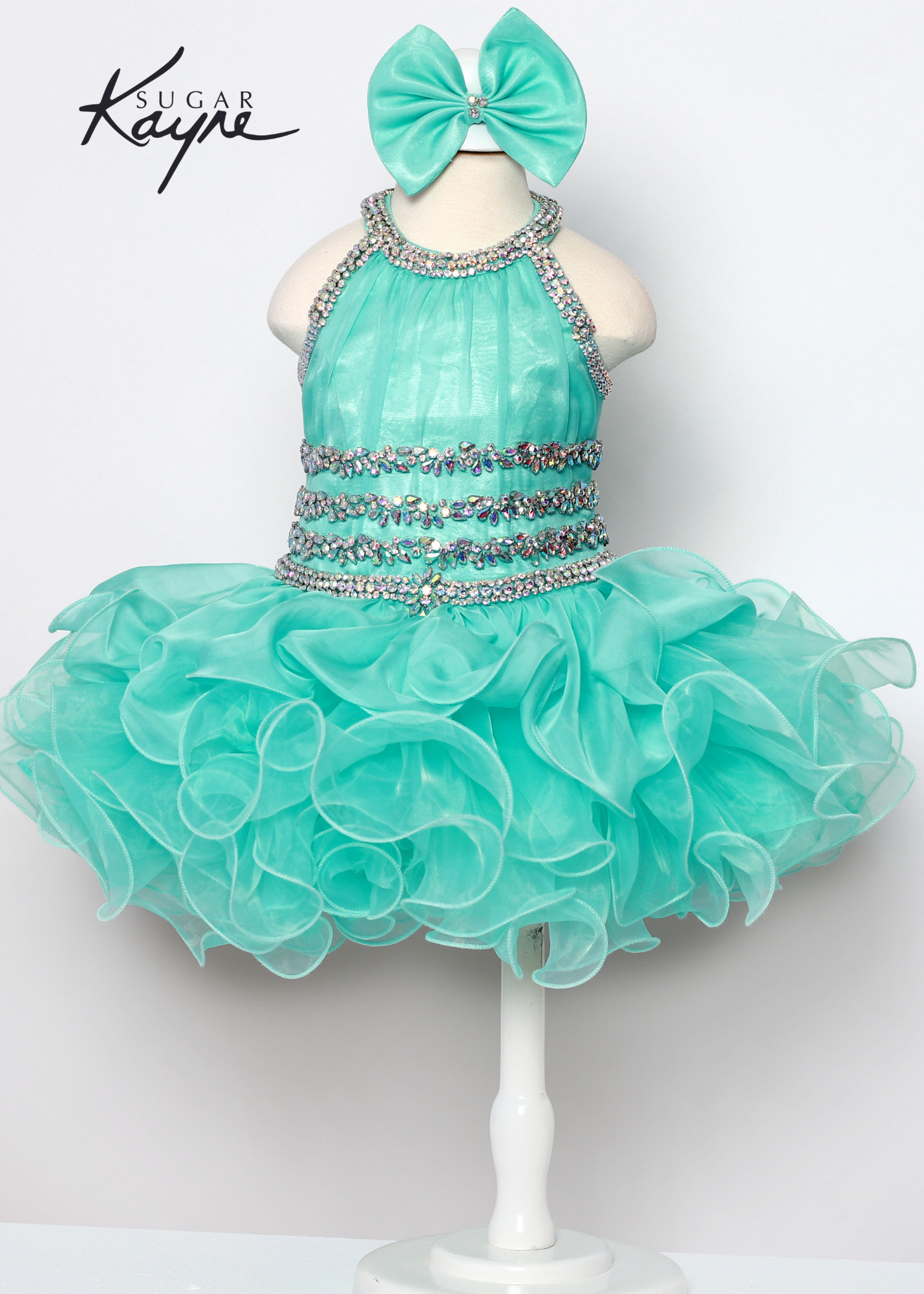 C216 Short girls Cupcake Ruffle High Neckline Pageant Dress Bow Crystal Embellished Have your little cupcake bring on all the charm in this stunning chiffon and organza gown. The corset back is the perfect addition as the little one grows!  Colors: Aqua, Hot Coral  Sizes:  0M, 12M, 18M, 24M, 2T, 3T, 4T, 5T, 6M, 6T  Fabric Chiffon, Organza, Satin Lining