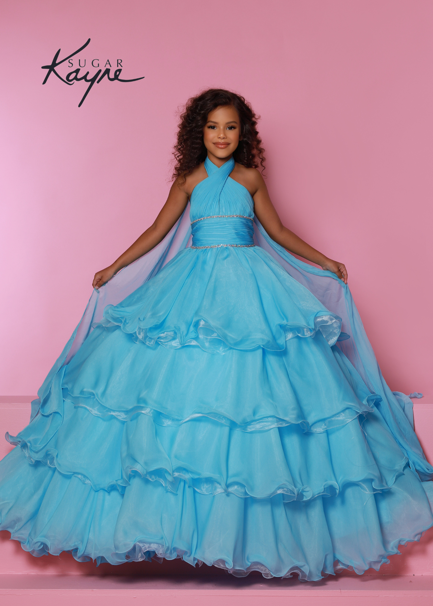 Sugar Kayne C305 Layer Girls Ruffle Pageant Ball Gown Cape Halter Formal Dress Oh s'cute!! This poly chiffon layered ballgown features a crisscross halter neckline with beaded trim along the waist. The train will float seamlessly across the stage, especially with the detachable cape.  Colors: Baby Blue, Lemon, White  Sizes: 2, 4, 6, 8, 10, 12, 14, 16  Fabric Poly Chiffon, Satin Lining