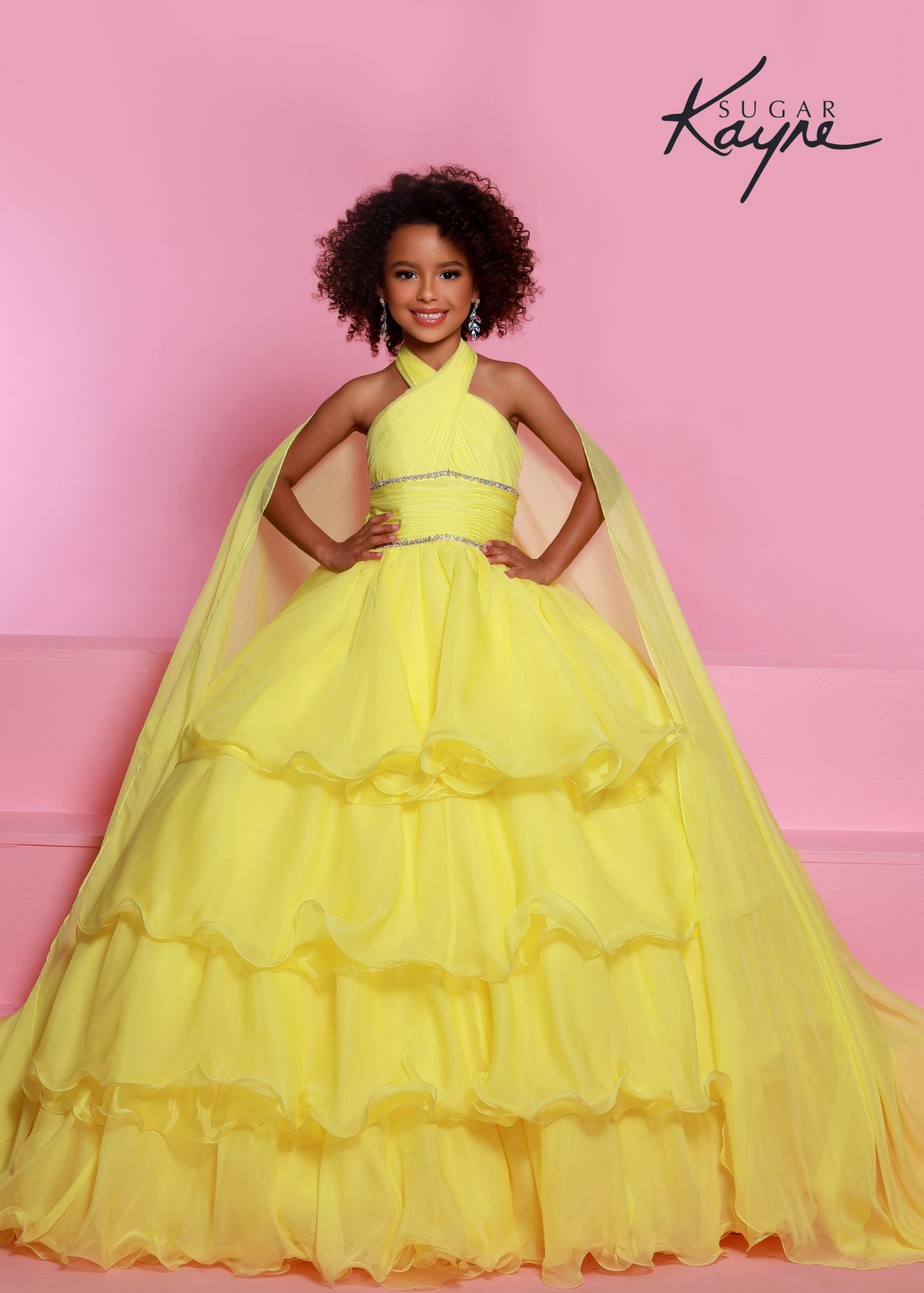 Sugar Kayne C305 Layer Girls Ruffle Pageant Ball Gown Cape Halter Formal Dress Oh s'cute!! This poly chiffon layered ballgown features a crisscross halter neckline with beaded trim along the waist. The train will float seamlessly across the stage, especially with the detachable cape.  Colors: Baby Blue, Lemon, White  Sizes: 2, 4, 6, 8, 10, 12, 14, 16  Fabric Poly Chiffon, Satin Lining